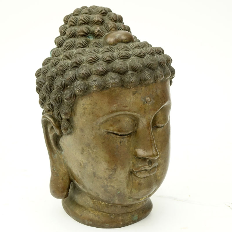 19/20th Tibetan Bronze Shakyamuni Buddha Head. Rubbing to gilt.