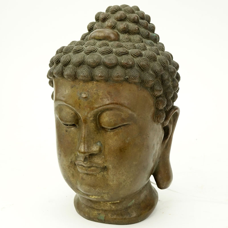 19/20th Tibetan Bronze Shakyamuni Buddha Head. Rubbing to gilt.