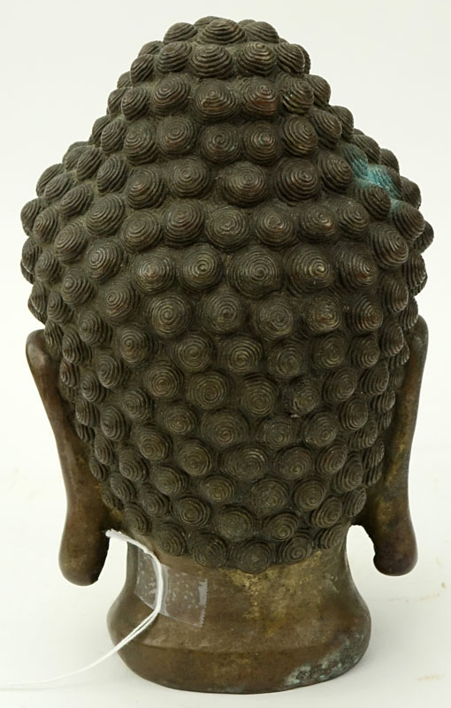19/20th Tibetan Bronze Shakyamuni Buddha Head. Rubbing to gilt.
