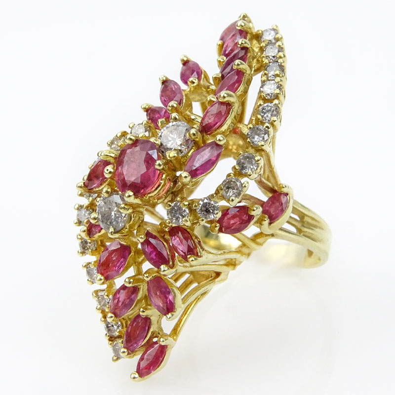 Vintage Marquise and Round Brilliant Cut Ruby, Round Brilliant Cut Diamond and 14 Karat Yellow Gold Cluster Ring.