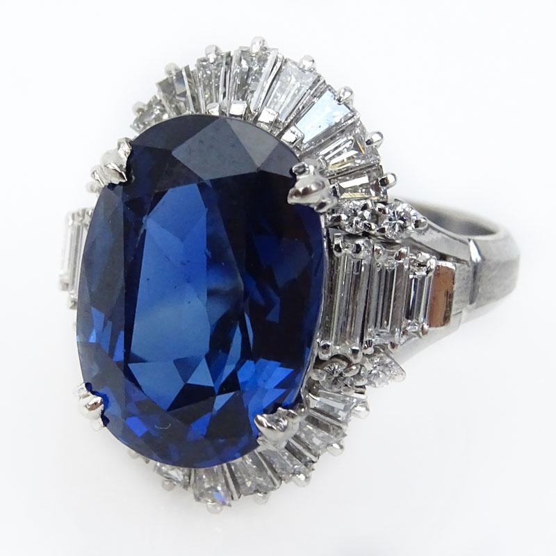 GIA Certified 9.84 Carat Natural Unheated Oval Cut Sapphire, 1.30 Carat Tapered Baguette and Round Brilliant Cut Diamond and Platinum Ring. 