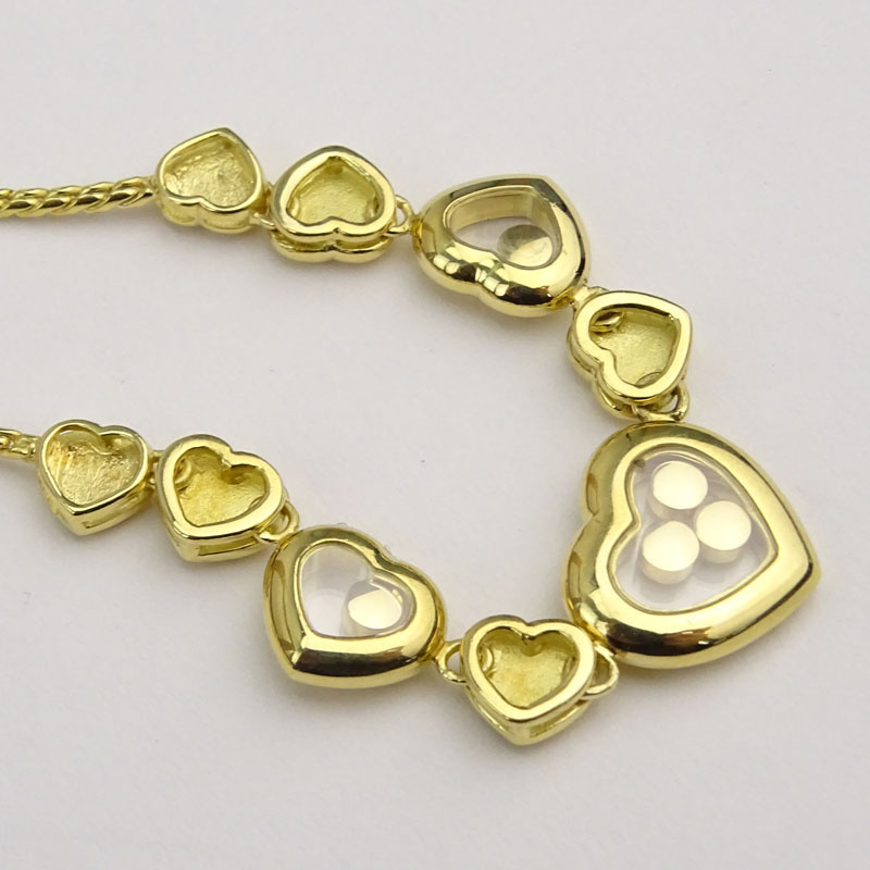 Vintage Chopard Happy Diamond and 18 Karat Yellow Gold Multi Hearts Charm Necklace.