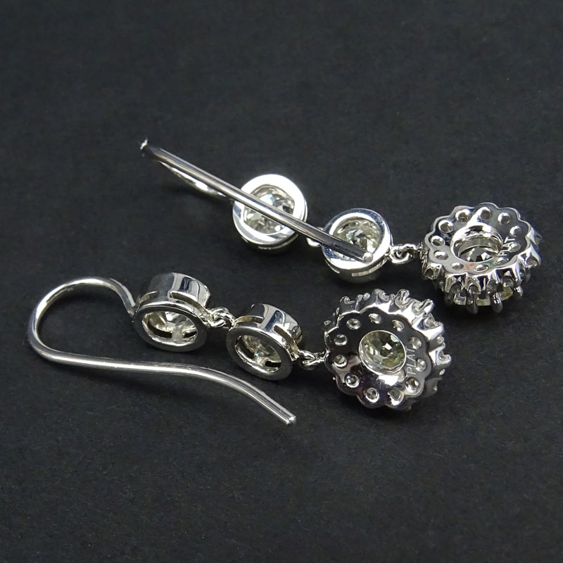 Approx. 4.47 Carat TW Old European Cut Diamond and Platinum Dangle Earrings.