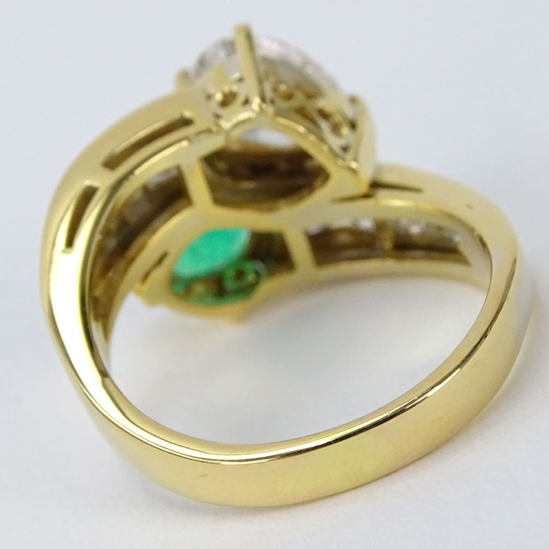 Vintage Approx. 1.18 Carat Pear Shape Diamond, 1.50 Carat Pear Shape Colombian Emerald and 18 Karat Yellow Gold Ring Accented with 1.50 Carat Round Brilliant Cut Diamonds. 