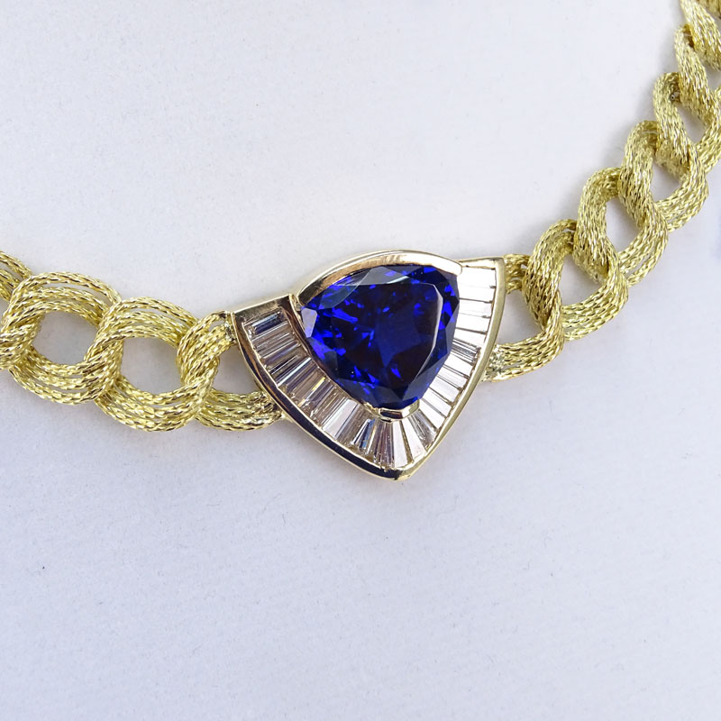 Approx. 16.0 Carat Triangular Cut Tanzanite, 4.0 Carat Baguette Cut Diamond and 18 Karat yellow Gold Pendant Necklace. 