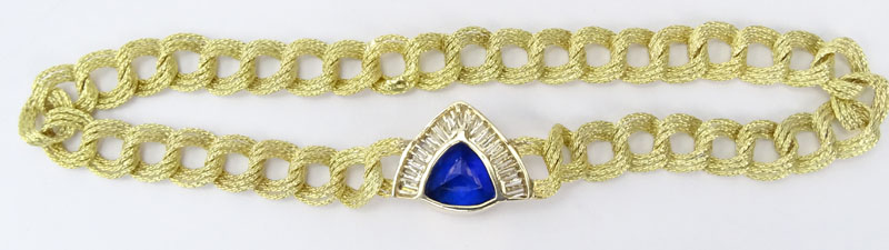 Approx. 16.0 Carat Triangular Cut Tanzanite, 4.0 Carat Baguette Cut Diamond and 18 Karat yellow Gold Pendant Necklace. 