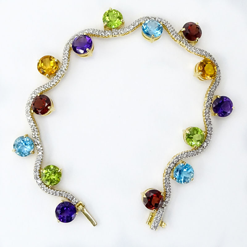 Vintage Approx. 19.50 Carat Multi Stone, Diamond and 18 Karat Yellow Gold Bracelet, Set with Amethysts, Topaz, Peridot and Citrine. 