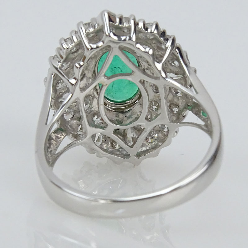 Approx. 2.16 Carat Oval Cut Emerald, 1.76 Carat TW Diamond and 18 Karat White Gold Ring. 