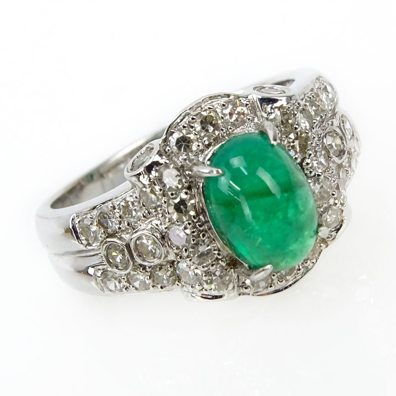 Approx. 1.43 Carat Cabochon Emerald, .64 Carat Diamond and 18 Karat White Gold Ring. 