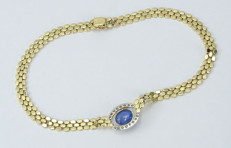 Vintage Approx. 14.25 Carat Cabochon Sapphire, .76 Carat Round Brilliant Cut Diamond and 14 Karat yellow Gold Necklace. 