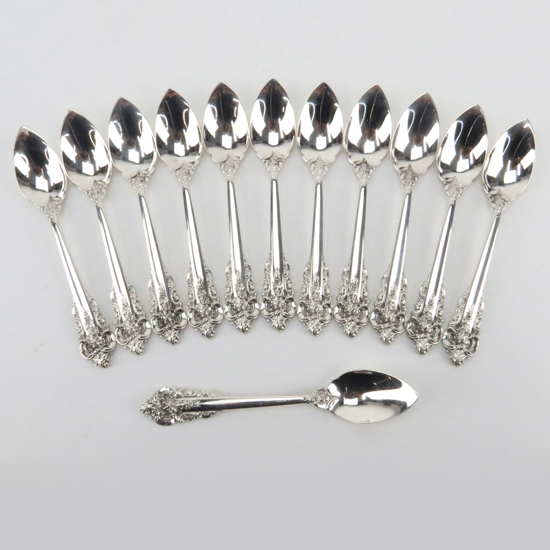 Set of Twelve (12) Wallace "Grand Baroque" Sterling Silver Fruit/Orange Spoons. 