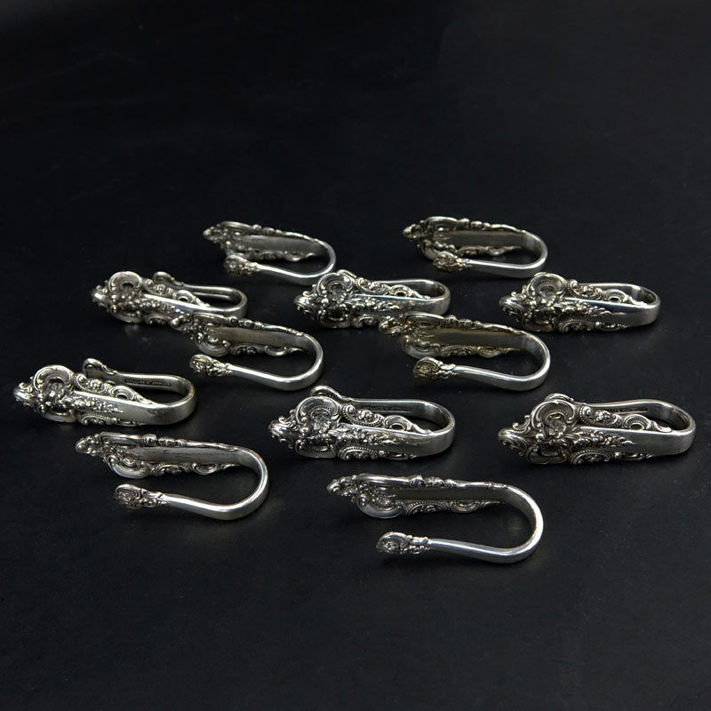 Set of Twelve (12) Wallace "Grand Baroque" Sterling Silver Napkin Clips. 