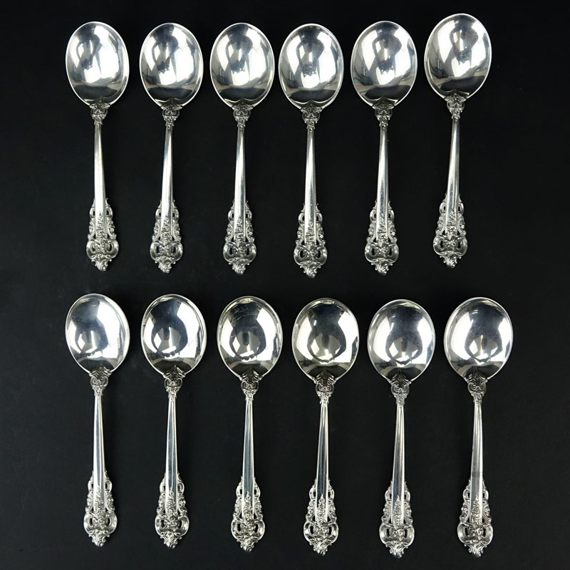 Set of Twelve (12) Wallace "Grand Baroque" Sterling Silver Round Bowl Soup Spoons. 