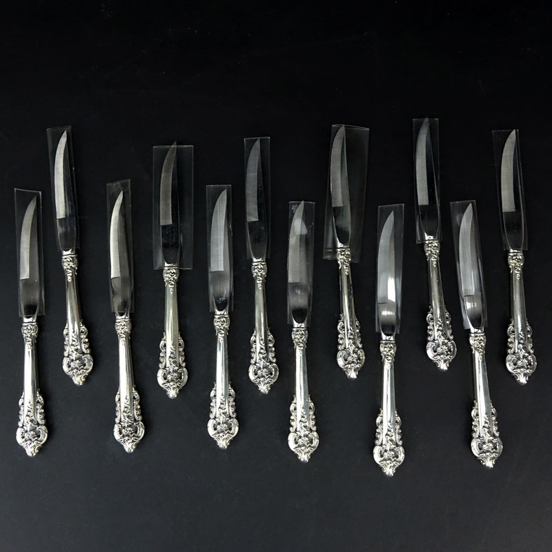 Set of Twelve (12) Wallace "Grand Baroque" Sterling Silver Handled Beveled Steak Knives.