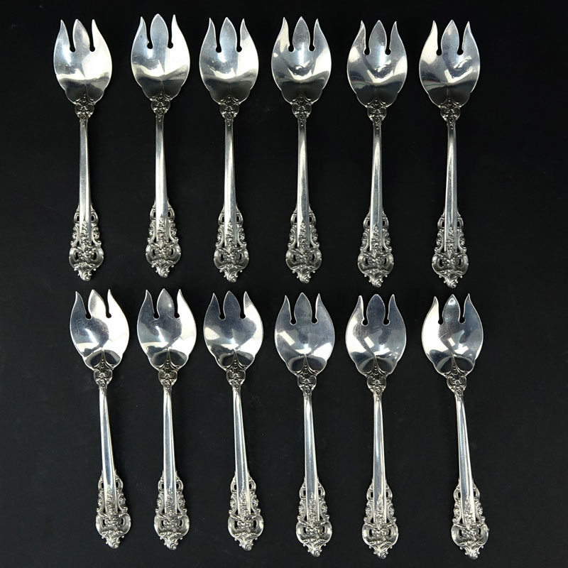 Set of Twelve (12) Wallace "Grand Baroque" Sterling Silver Ice Cream Forks. Circa 1941.