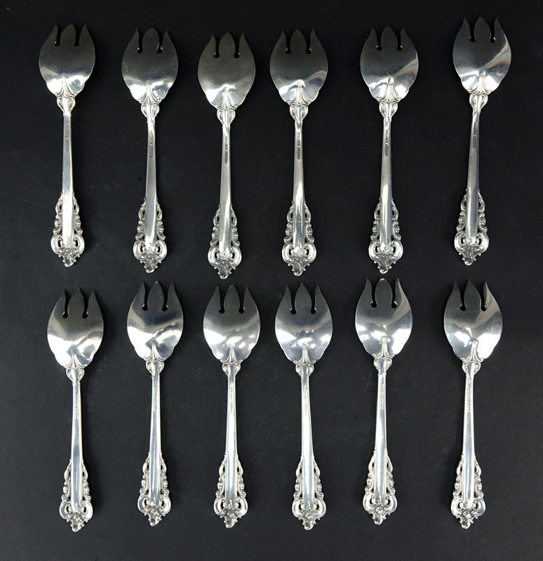 Set of Twelve (12) Wallace "Grand Baroque" Sterling Silver Ice Cream Forks. Circa 1941.