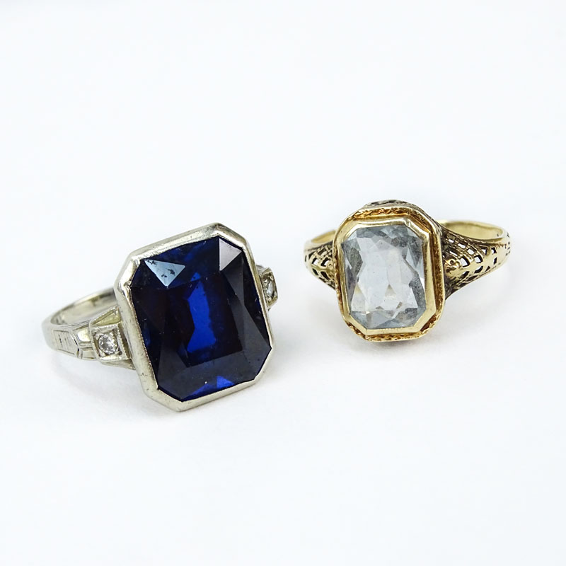 Two Antique Rings, one 10 Karat Yellow Gold and Blue Topaz, one 14 Karat White Gold with a  Man Made Sapphire. 