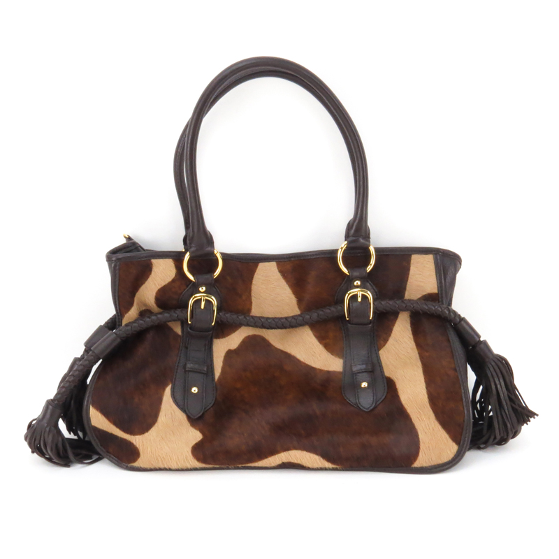 Adrienne Vittadini Cowhide and Leather Bag. Satin interior with zipper and slot pockets, magnetic closure. Marked appropriately.