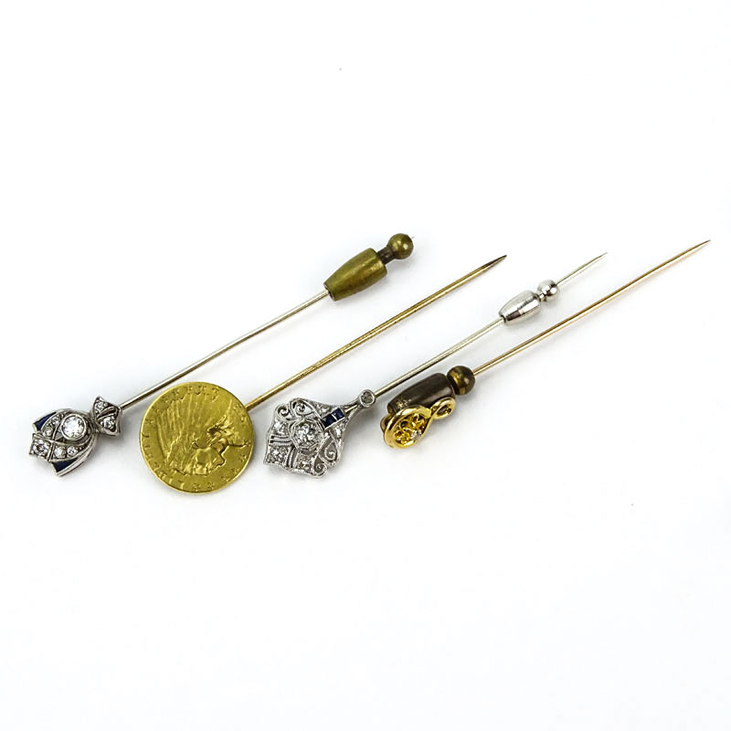 Collection of Four Stick Pins Including: Two (2) Antique Platinum, Diamond and Sapphire Pins.