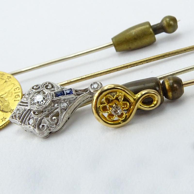 Collection of Four Stick Pins Including: Two (2) Antique Platinum, Diamond and Sapphire Pins.