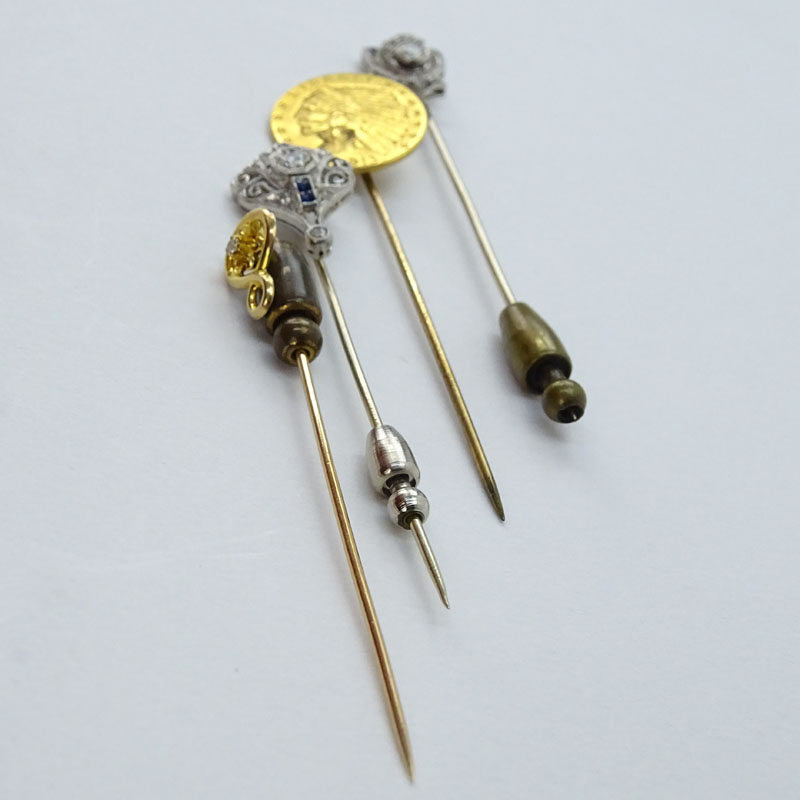 Collection of Four Stick Pins Including: Two (2) Antique Platinum, Diamond and Sapphire Pins.