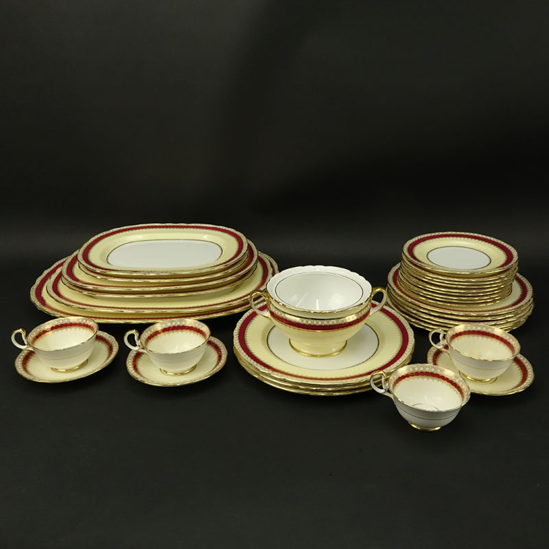 Thirty Two (32) Piece Aynsley Maroon and Gilt Porcelain Scalloped Edge Dinnerware.