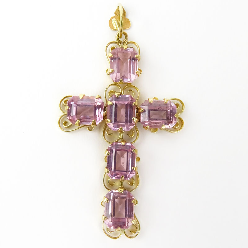 18 Karat Yellow Gold and Pink Stone Cross Pendant. Stamped 18K.