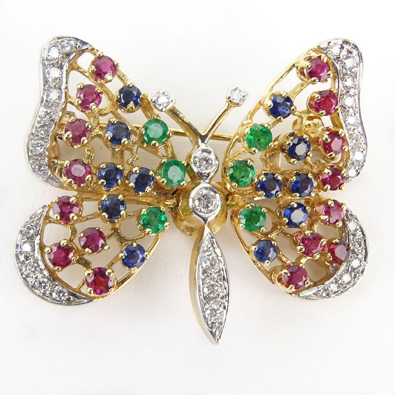 Vintage 14 Karat Yellow Gold Articulated Butterfly Brooch set with Diamonds, Rubies, Emeralds and Sapphires.