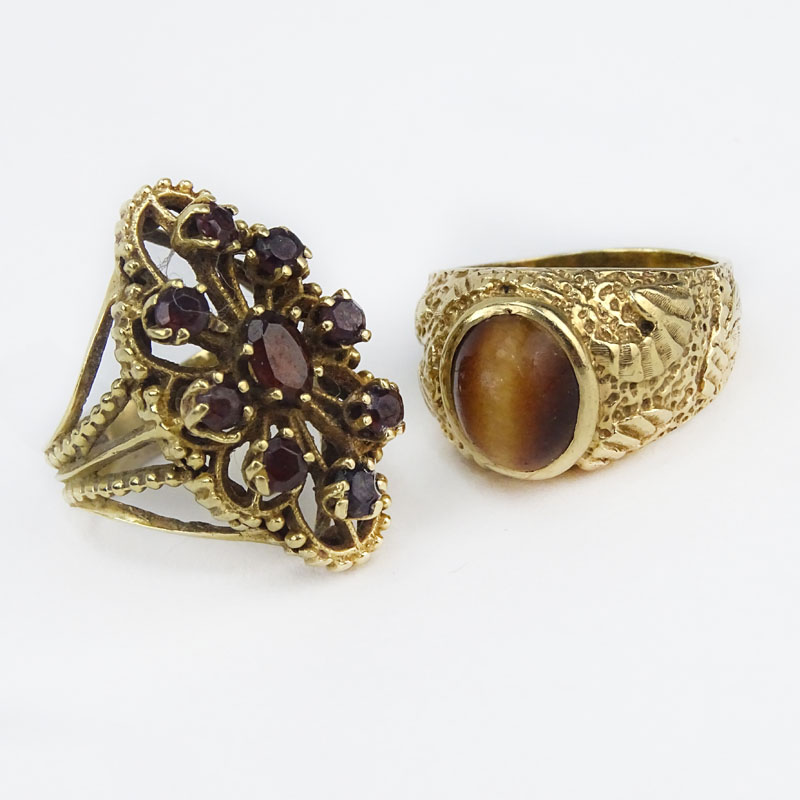 Vintage 14 Karat Yellow Gold and Cat's Eye together with a Vintage Garnet and 14 Karat Yellow Gold Cluster Ring.