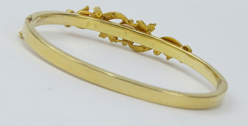 Vintage 14 Karat Yellow Gold Bangle Bracelet set with an Oval Cut Opal and Seed pearls.