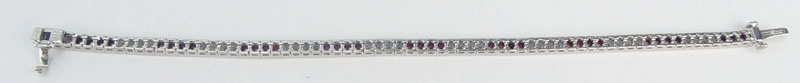 Approx. 3.82 Carat Calibre Cut Ruby, 1.76 Carat Round Brilliant Cut Diamond and Platinum Bracelet. .