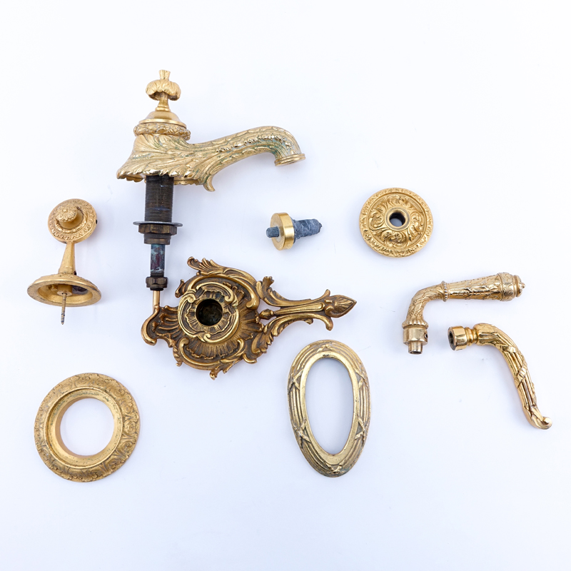 Nine (9) Pieces Sherle Wagner Miscellaneous Gold Plated Fixtures. Includes, spout, odd handles, collars etc. 