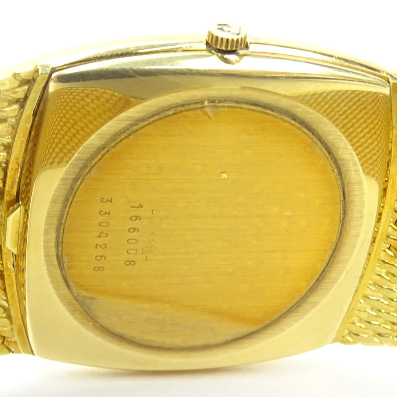 Man's Vintage Universal Geneve 18 Karat Yellow Gold Golden Shadow Bracelet Watch with Automatic Movement.