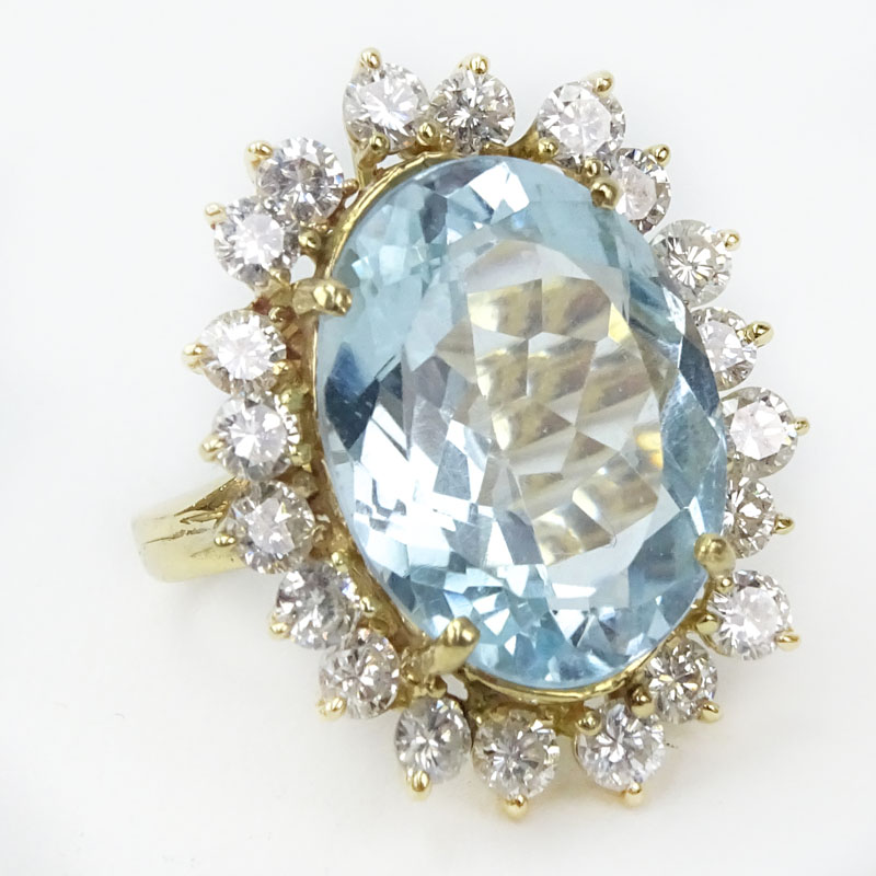 Vintage Approx. 13.70 Carat Oval Cut Aquamarine, 2.25 Carat Round Brilliant Cut Diamond and 14 Karat Yellow Gold Ring. 