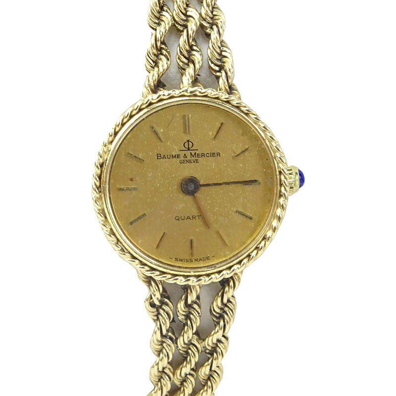 Lady's Vintage Baume & Mercier Genève 14 Karat Yellow Gold Bracelet Watch with Swiss Quartz Movement.