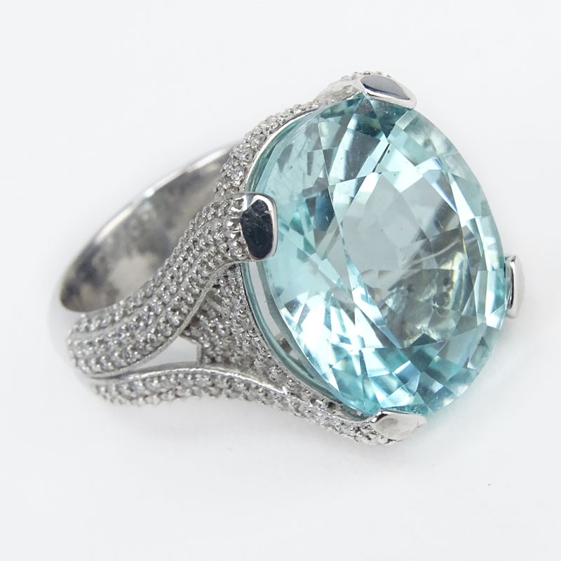 Rare EGL and BHGL Certified 18.7 Carat Oval Cut Mozambique Paraiba Tourmaline, 2.5 Carat Pave Set Diamond and 18 Karat White Gold Ring. 