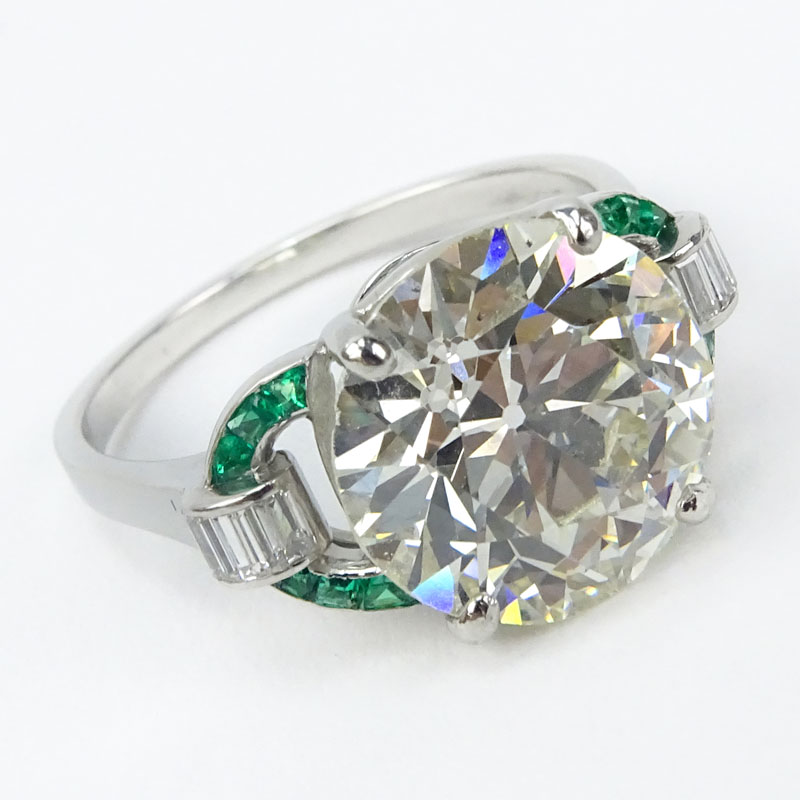 GIA Certified Art Deco 6.19 Carat Old European Cut Diamond and Platinum Engagement Ring with Emerald and Diamond Accents.