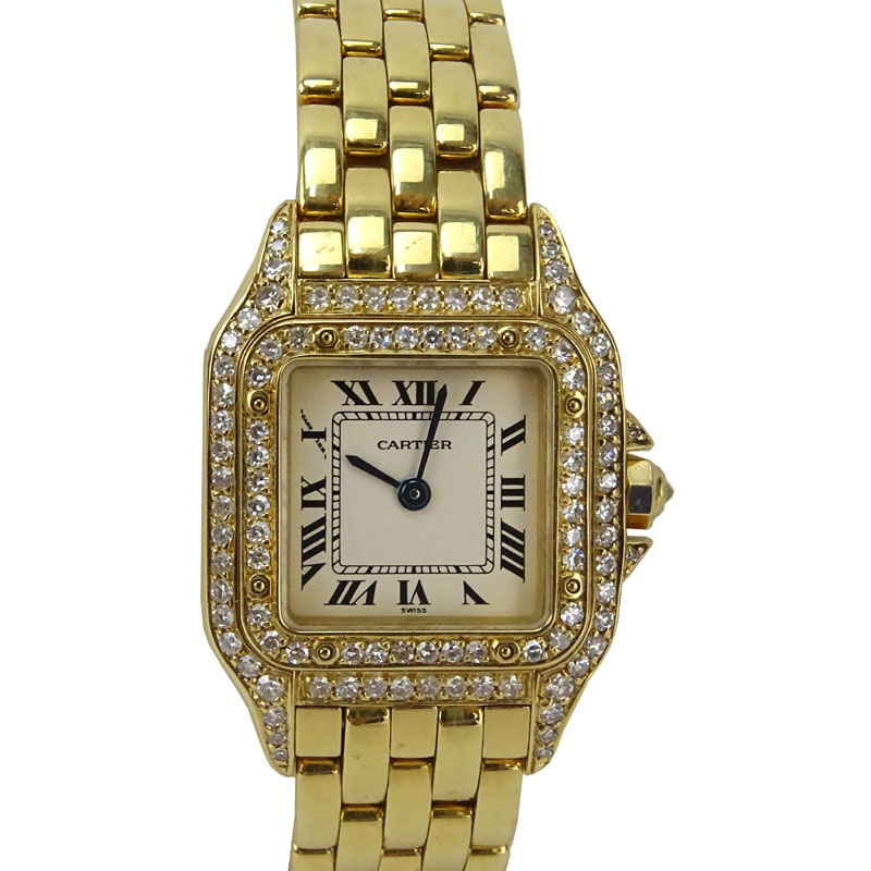 Lady's Cartier 18 Karat Yellow Gold and Diamond Panther Bracelet Watch with Swiss Quartz Movement, Box, Papers and Extra Bracelet Links. 