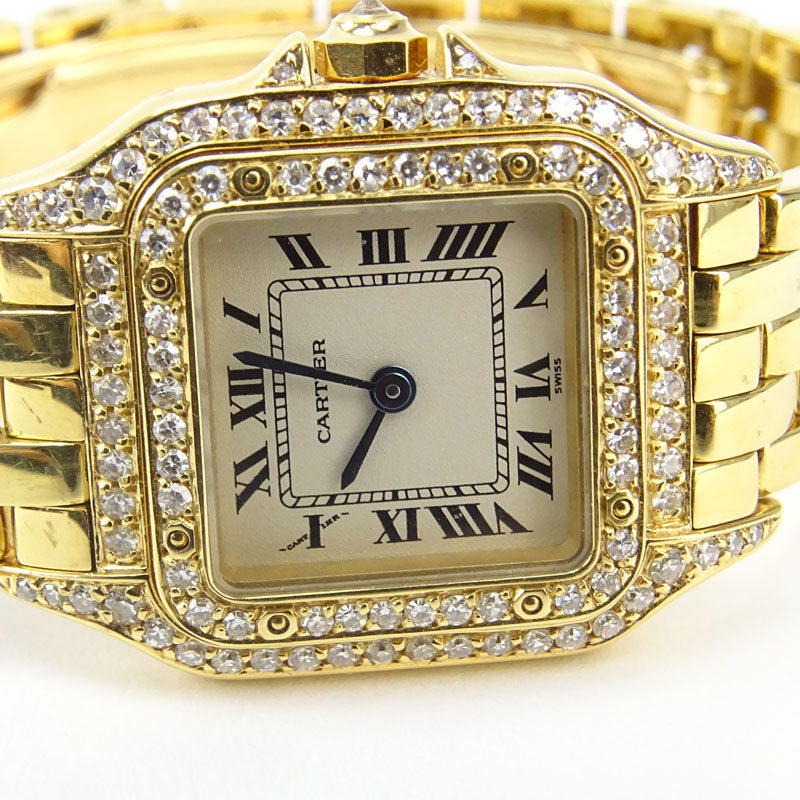 Lady's Cartier 18 Karat Yellow Gold and Diamond Panther Bracelet Watch with Swiss Quartz Movement, Box, Papers and Extra Bracelet Links. 