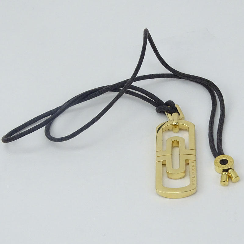 Vintage Bulgari 18 Karat Yellow Gold Parentisi Pendant Necklace on Black Cord.