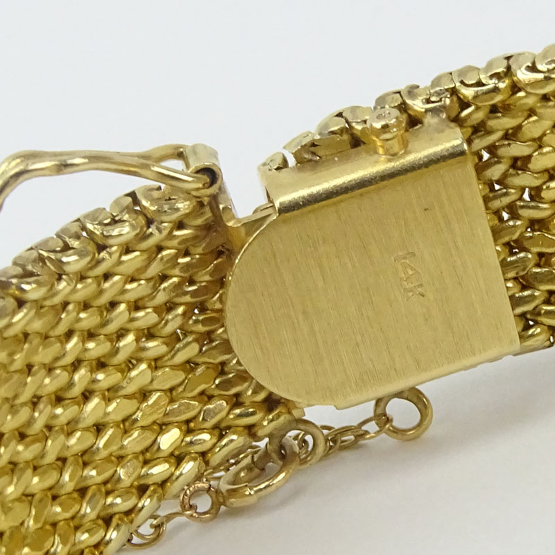 Vintage Luva 14 Karat Yellow Gold Flip Top Bracelet Watch with Mother of Pearl Dial and Manual Movement.