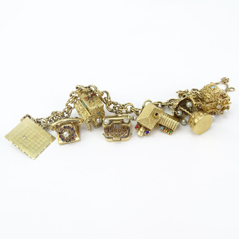 Vintage Heavy 14 Karat Yellow Gold Charm Bracelet with Seven (7) Charms.