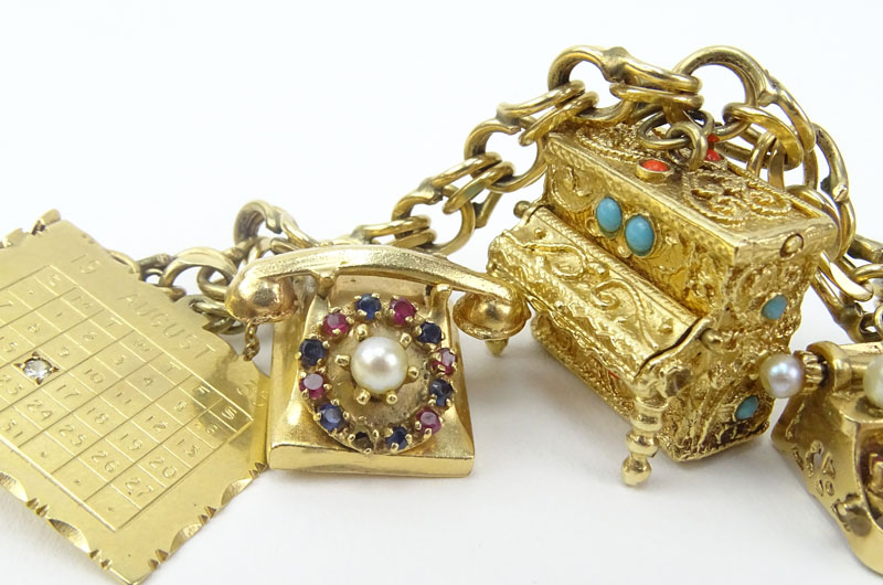 Vintage Heavy 14 Karat Yellow Gold Charm Bracelet with Seven (7) Charms.