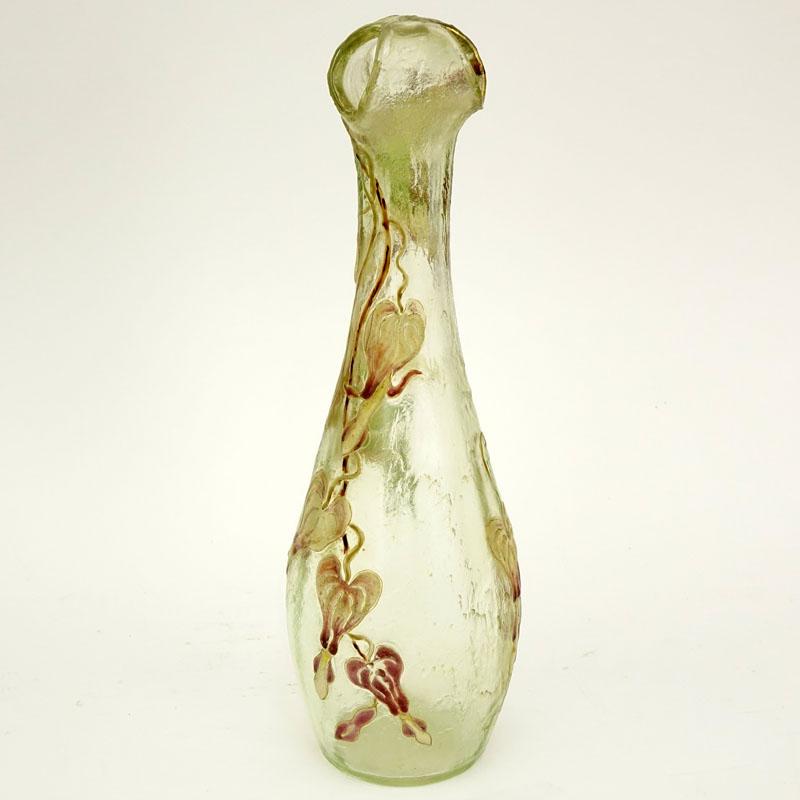 Early and fine Galle vase, unusual shape with a corolla top in textured clear glass having a subtle green tint, fire polished surface with some patination, nicely detailed enameled bleeding heart designs. 