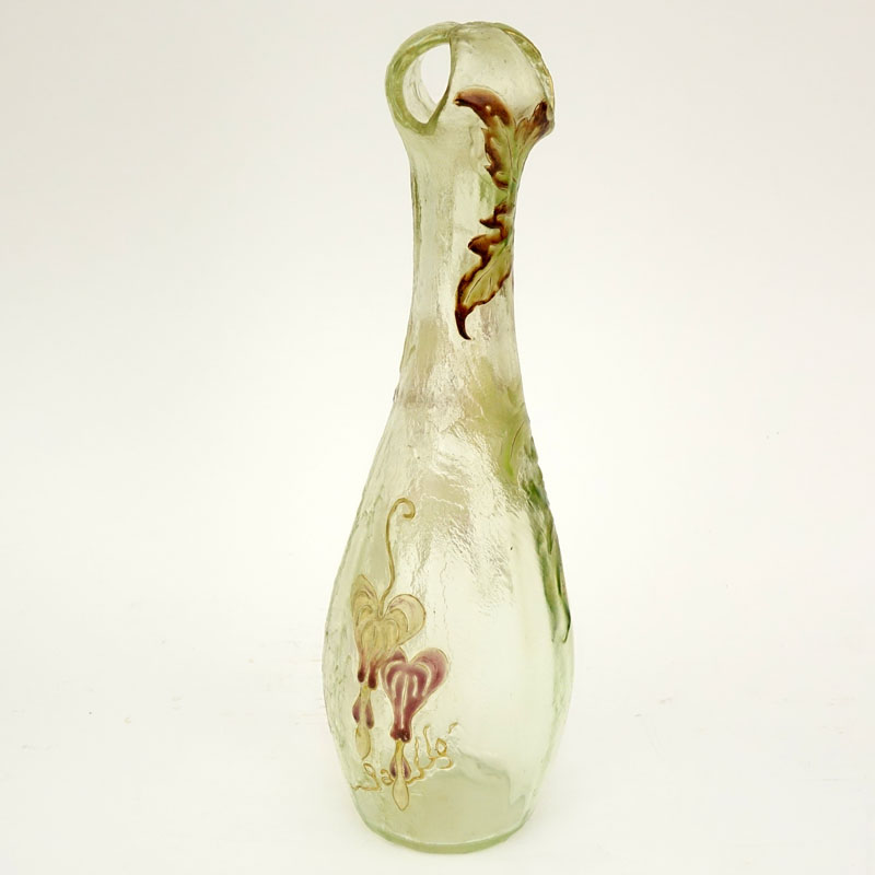 Early and fine Galle vase, unusual shape with a corolla top in textured clear glass having a subtle green tint, fire polished surface with some patination, nicely detailed enameled bleeding heart designs. 