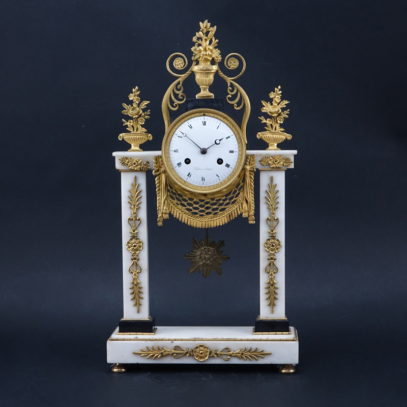 Antique French Marble And Gilt Bronze Clock. ''Babin a Corbeil'' on porcelain face.