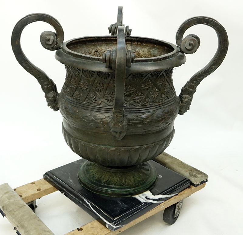 Pair of Large Bronze Figural Handled Garden Urns On Marble Bases.