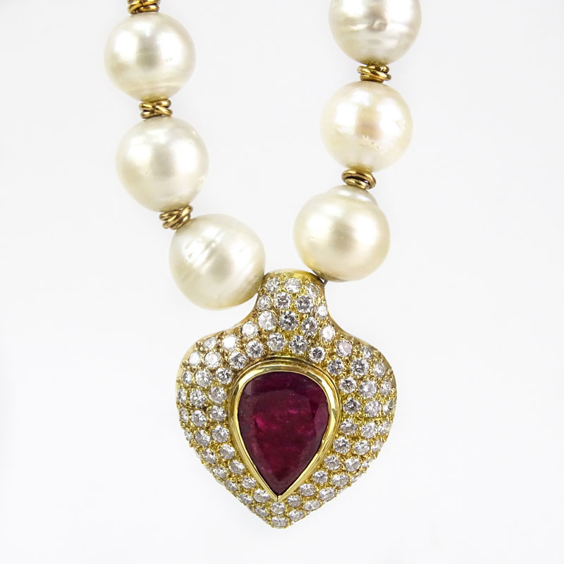 Vintage Large Pear Shape Burma Ruby, Approx. 8.0-8.5 Carat Round Brilliant Cut Diamond, Baroque Pearl and 18 Karat Yellow Gold Pendant Necklace. 