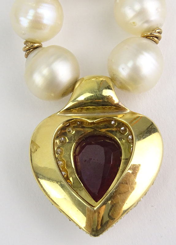 Vintage Large Pear Shape Burma Ruby, Approx. 8.0-8.5 Carat Round Brilliant Cut Diamond, Baroque Pearl and 18 Karat Yellow Gold Pendant Necklace. 