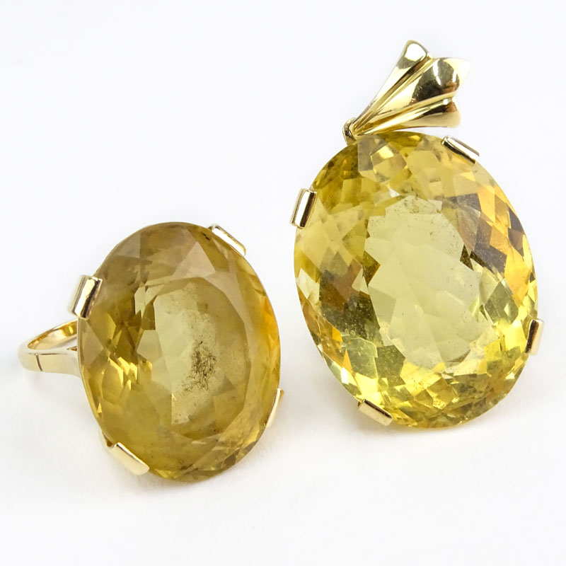 Large Oval Cut Yellow Topaz and 18 Karat Yellow Gold Ring and Pendant Suite.